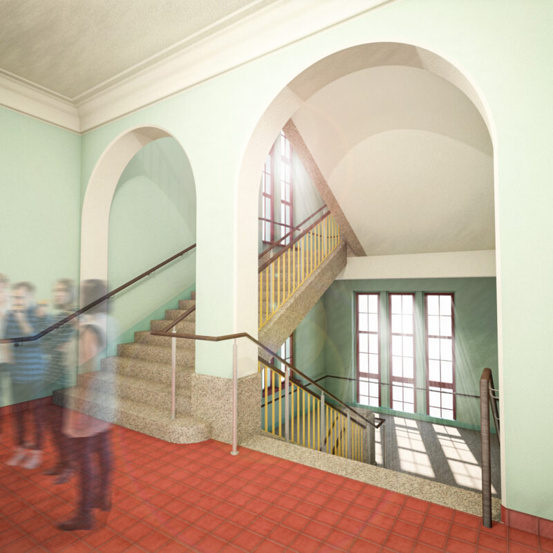 Innenraumperspektive im Treppenhaus des Erich-Rammler-Baus. Das Sonnenlicht scheint durch die Fenster